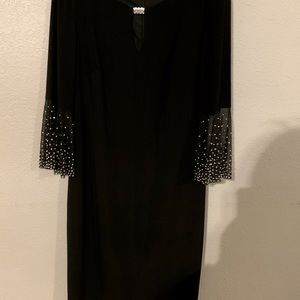 Jackie Jon knee length dress. Black. Rhinestone sleeves. Size 10.